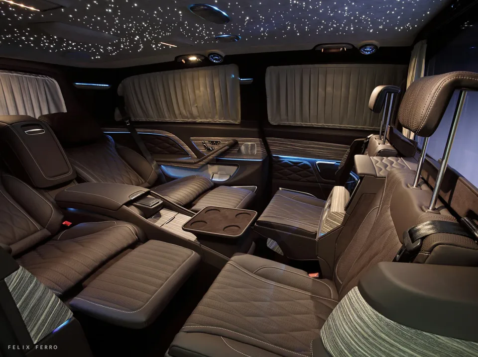 Two reclining seats with leg rests and tables