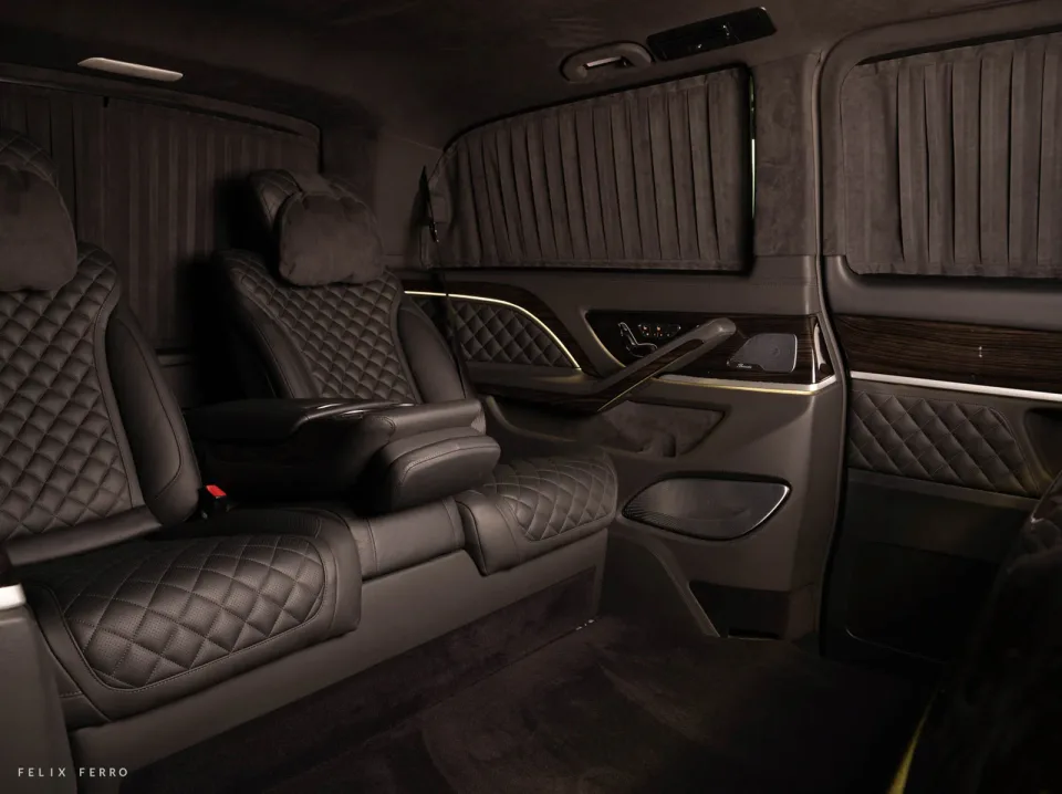 Dark passenger seats with a console between them