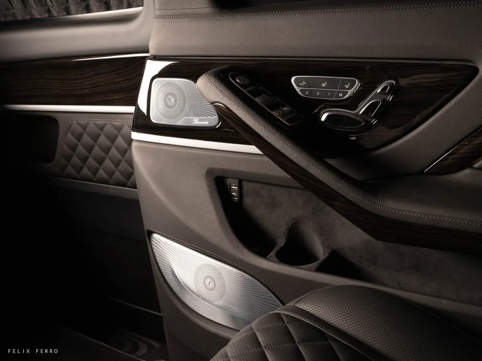 Wood insert, leather stitching and controls in the side panel